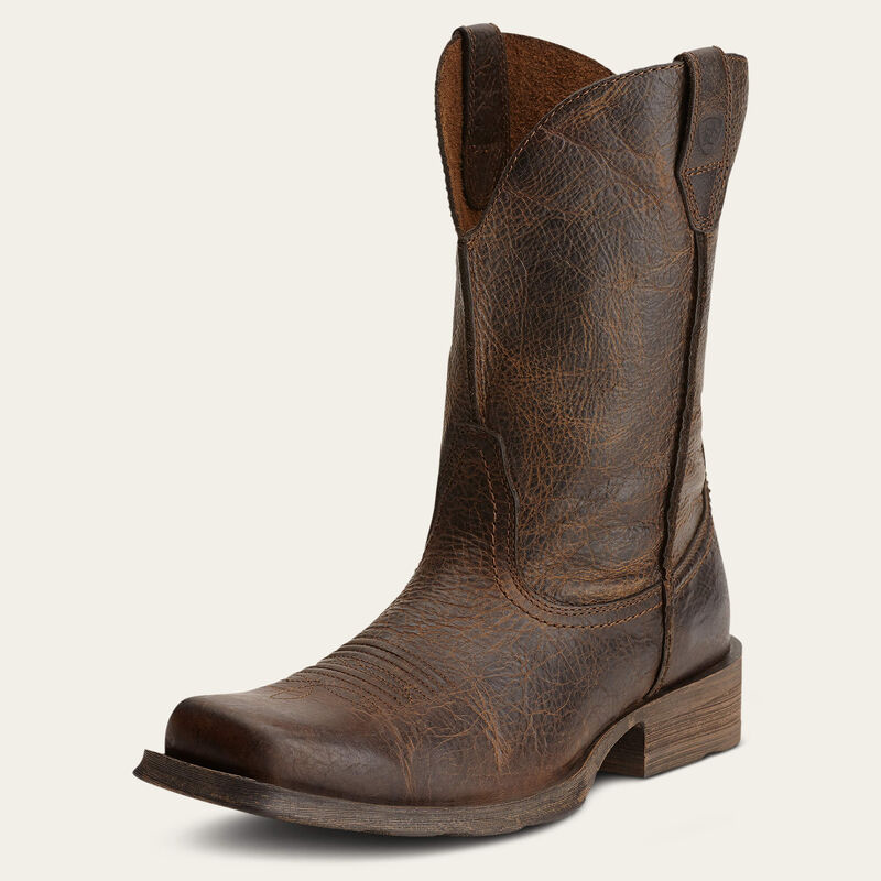 Brown leather cowboy boot on a white background